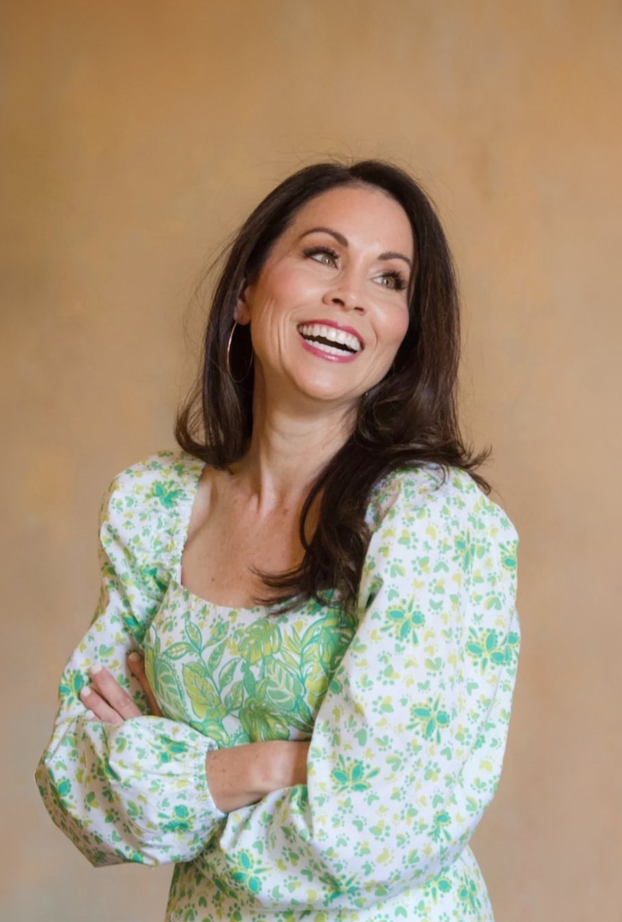 Jennifer Moorman smiling in a green floral dress